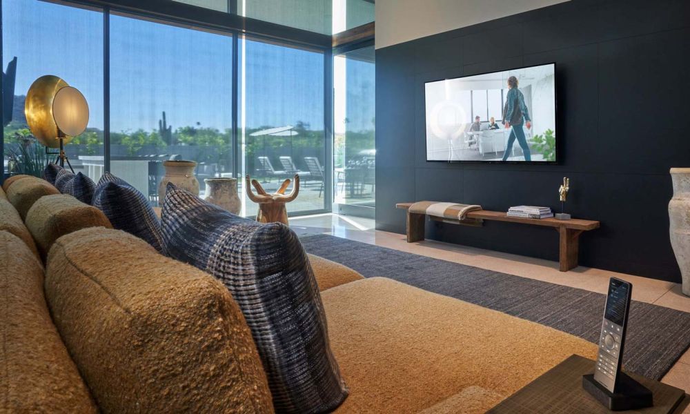 Crestron interface on touch panel next to bed