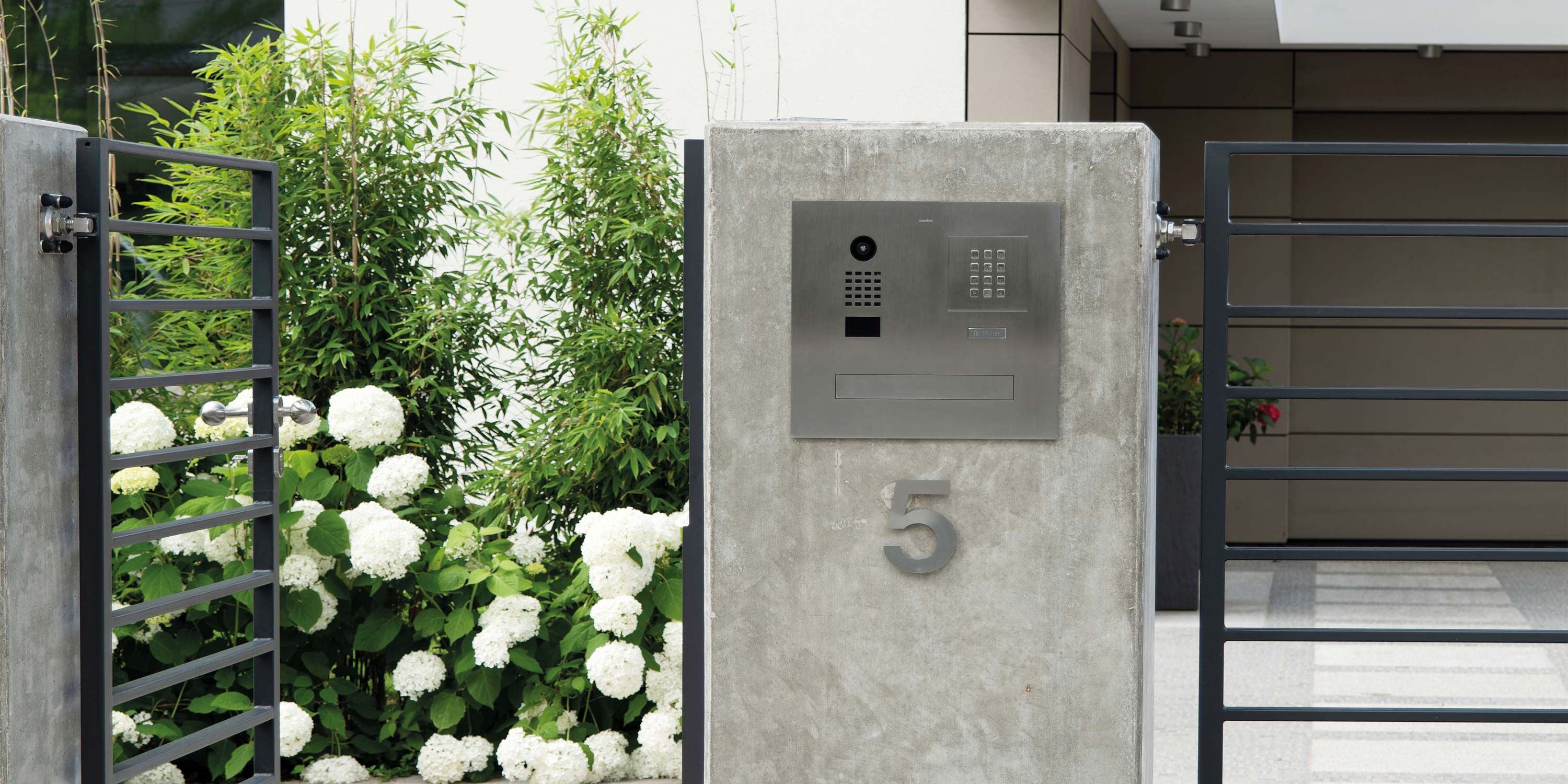 gated entry to large mansion