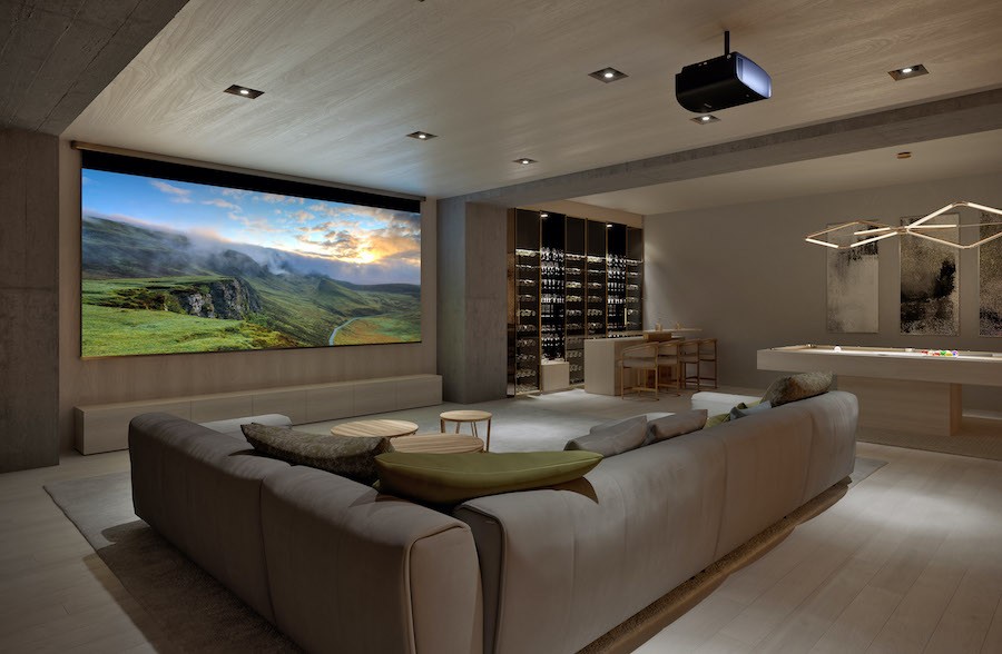 home theater with beige furniture, large projection screen, and projector