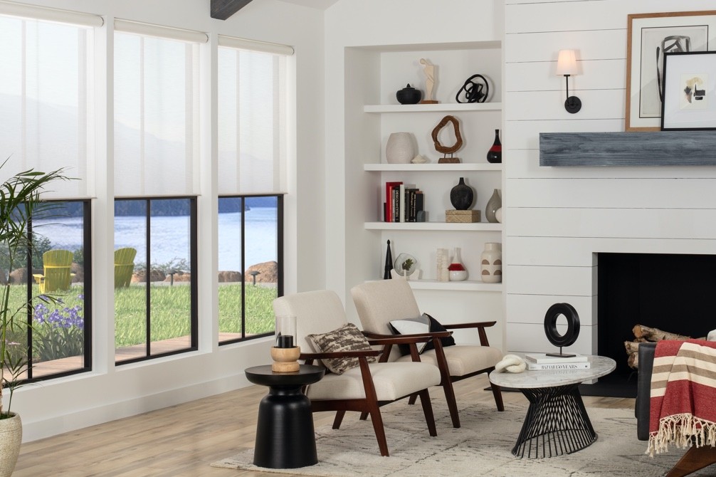  a living room with a round coffee table and sofas.