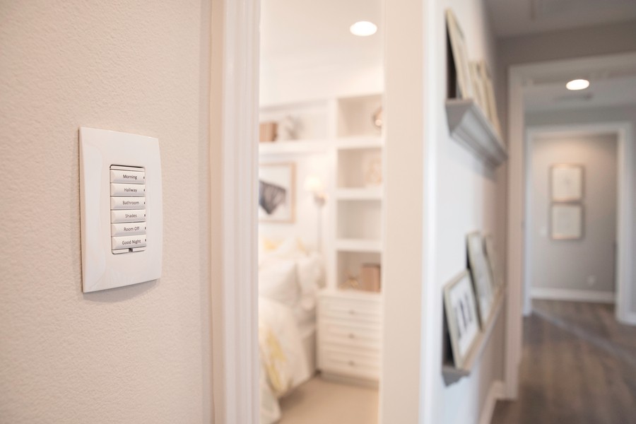 A home with smart lights and a Control4 wall panel.