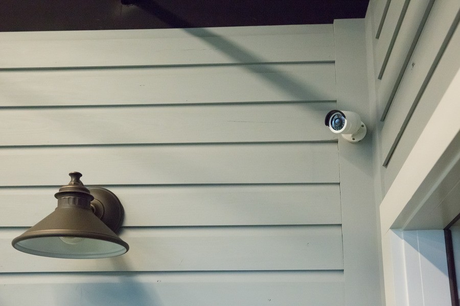 A security camera mounted on an exterior wall.