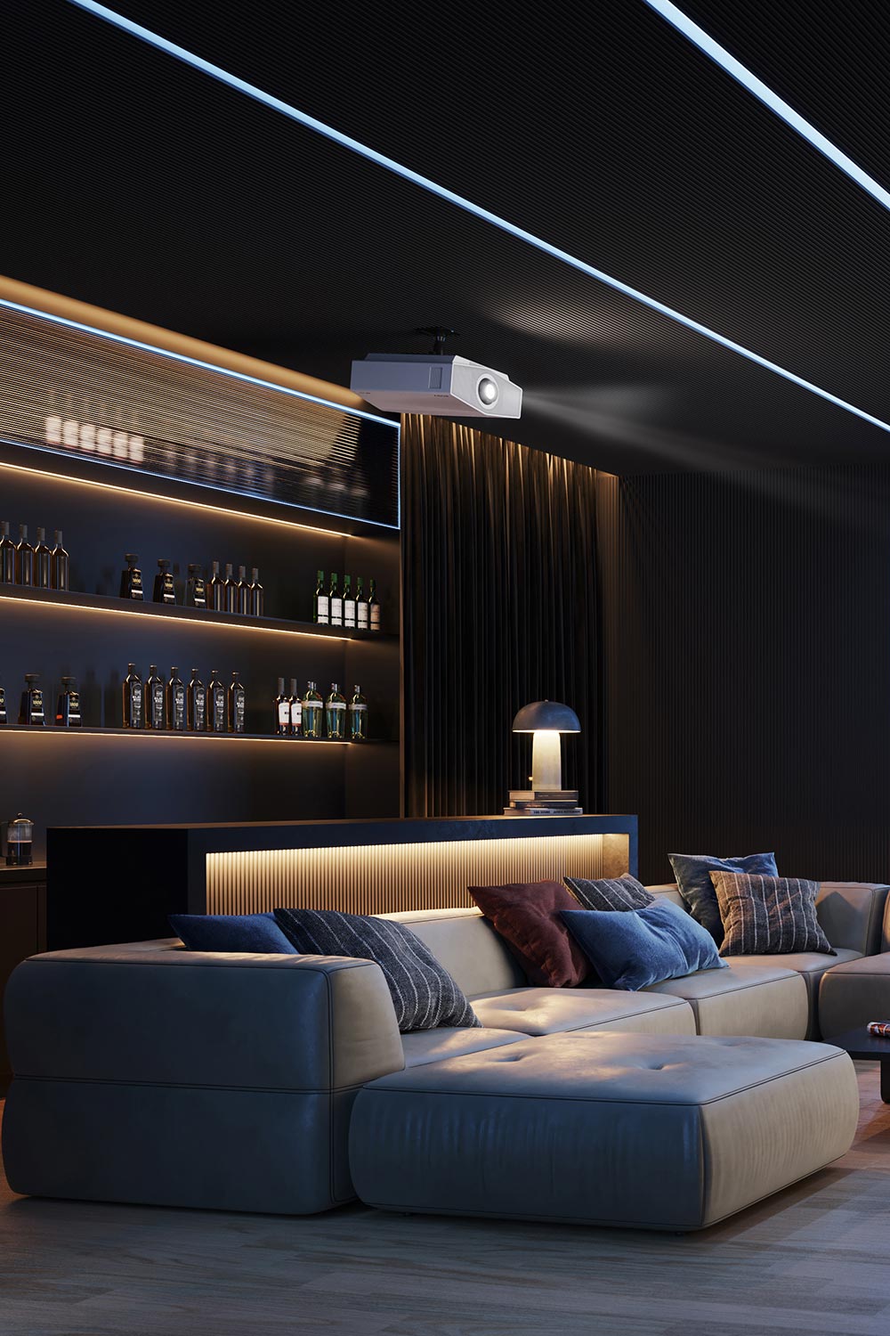 Projector mounted on a dark ceiling in a luxury lounge with a bar and sectional sofa