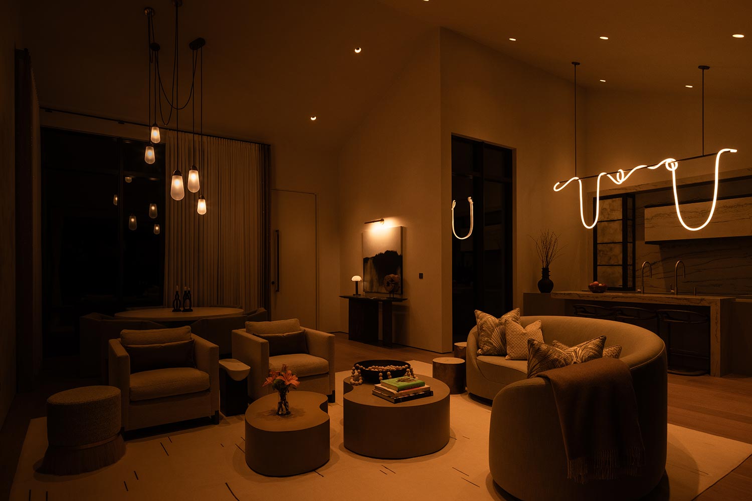 Open-concept living space set to a very dark, cozy evening lighting mode
