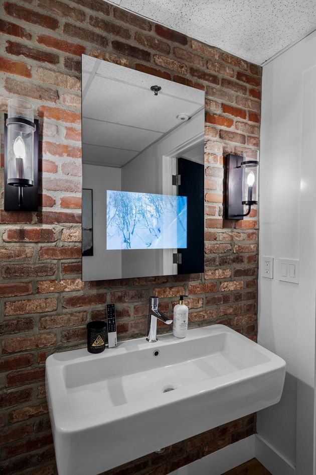 Eyehear Showroom's Bathroom with Seura's Mirrored TV