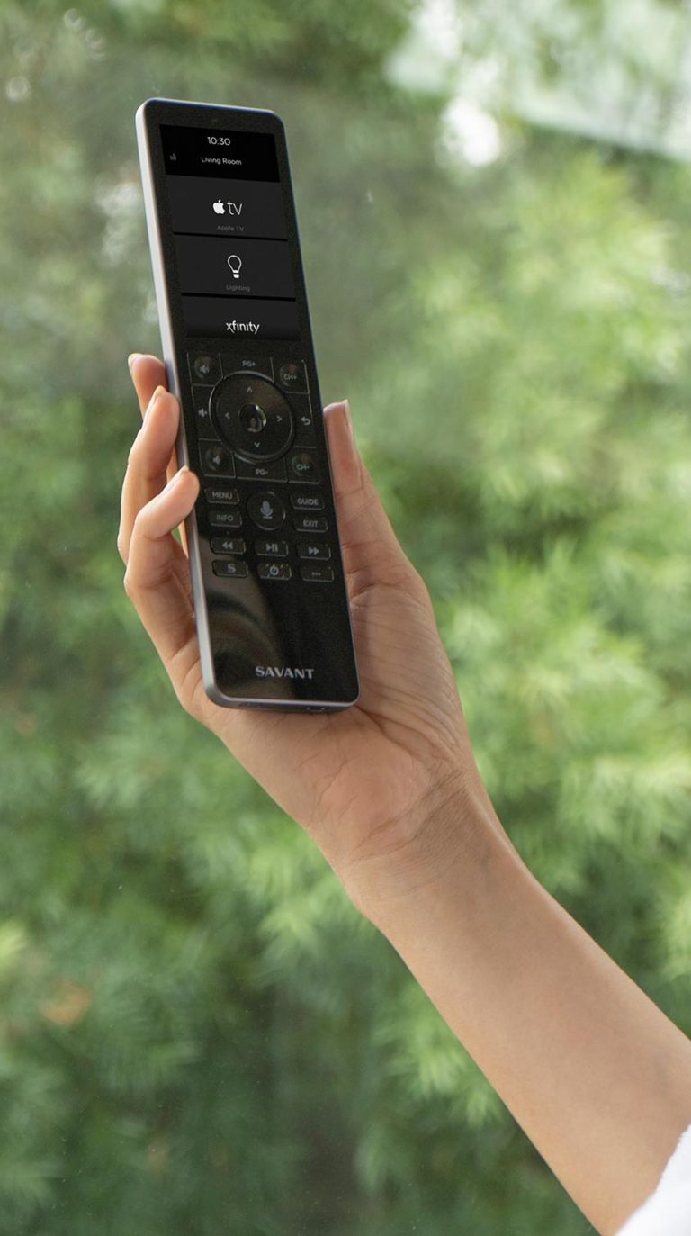 Up-close image of person interacting with Control4 touchpad
