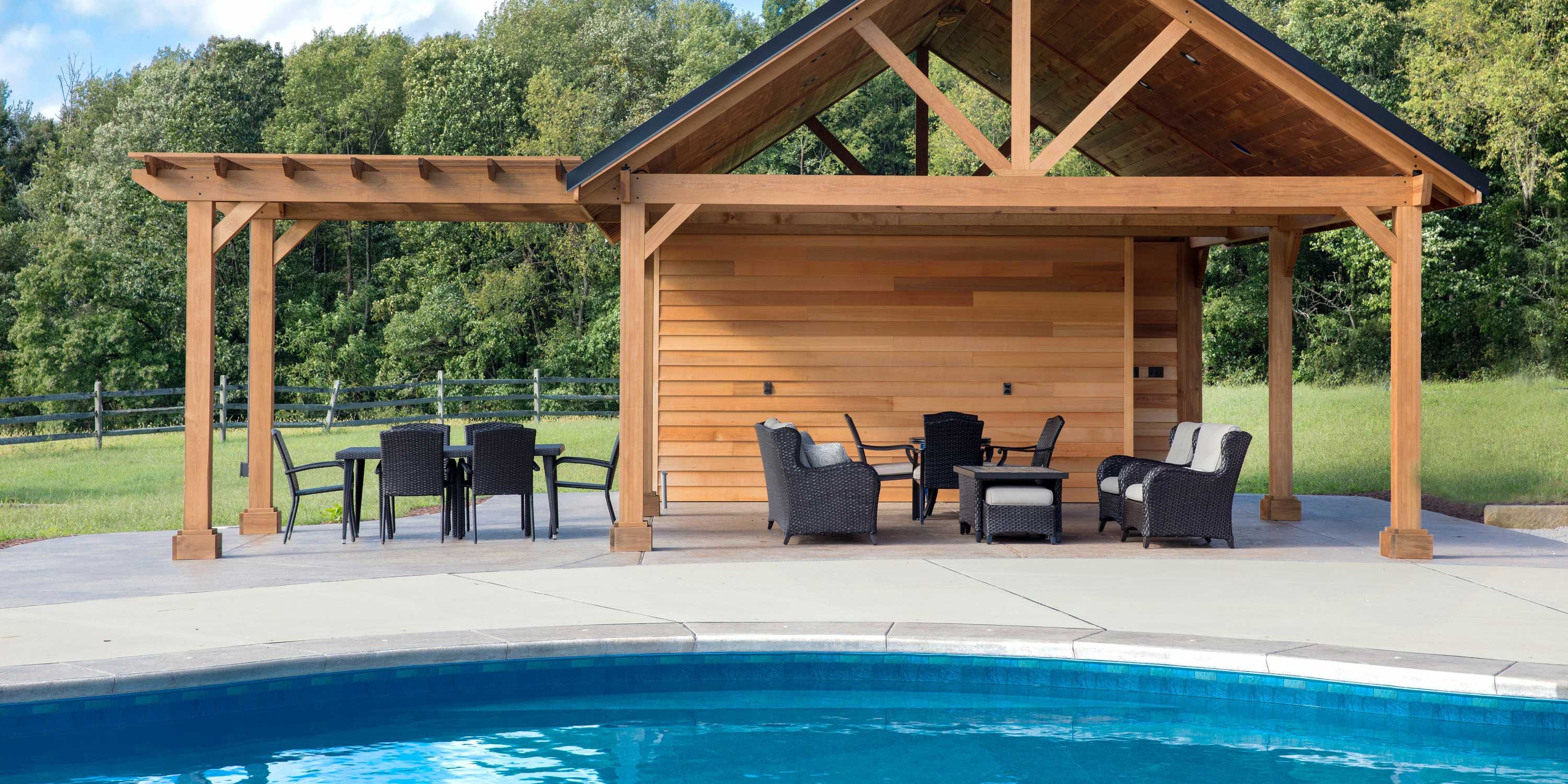 outdoor swimming pool by wooden pool pergola