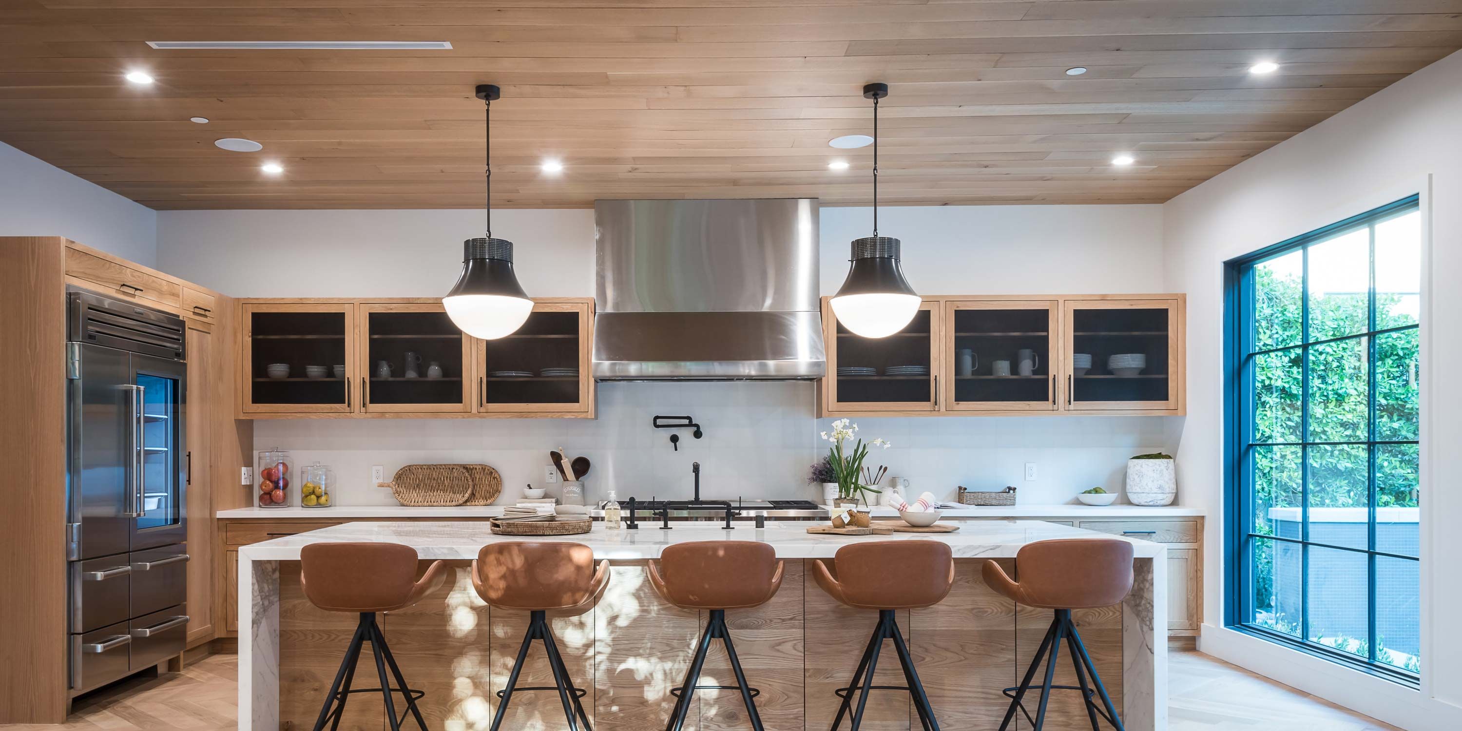warm toned lutron kitchen with dining table and autumn