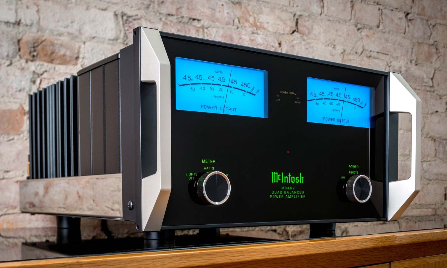 McIntosh audio in room with wooden floors and brick walls